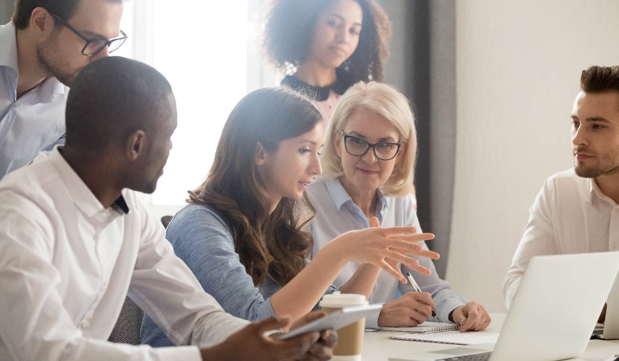 An image depicting a diverse group of engaged learners actively participating in a deep discussion during their interactive learning program