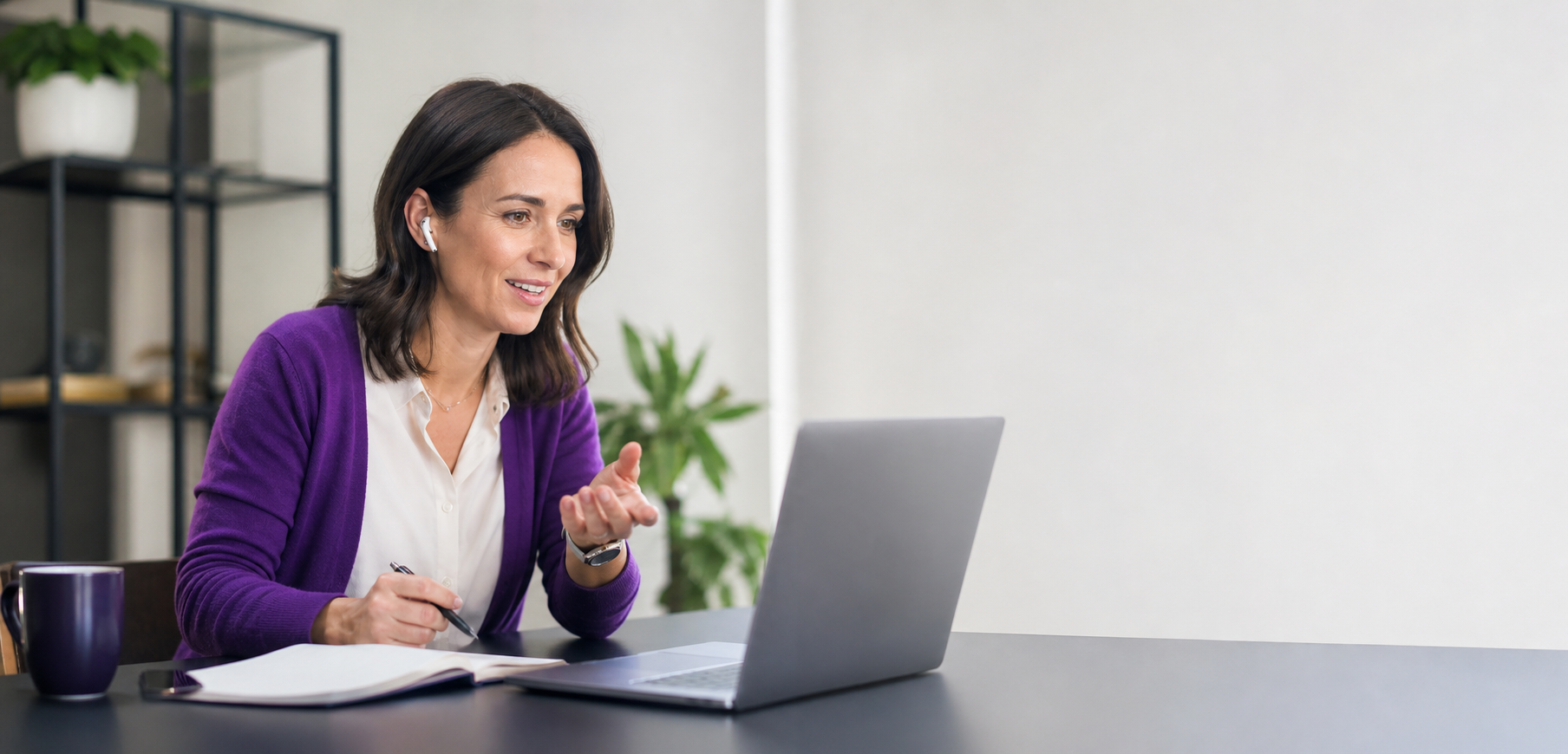 Professional French Individual in Modern Workspace Watching Webinar