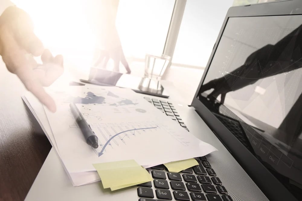 Close up of business man hand working on laptop computer with social media diagram and chart graph on wooden desk as concept-1