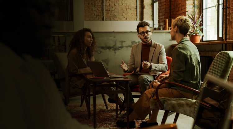 three-managers-discussing-their-ideas-by-table-2021-09-24-03-45-39