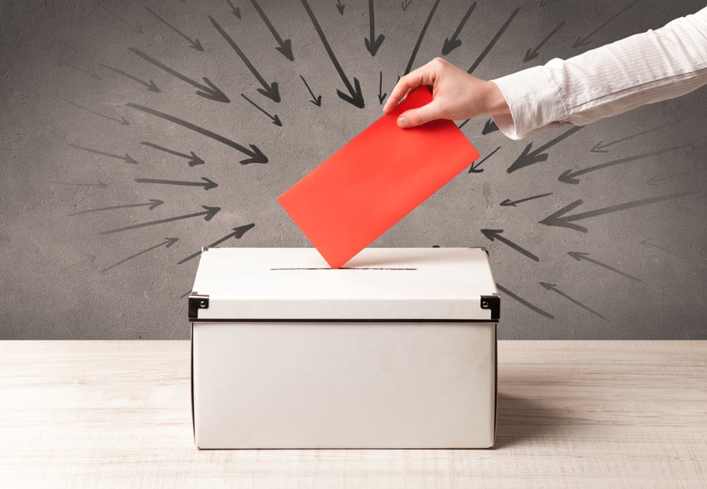 close up of a ballot box and casting vote on grungy background-1