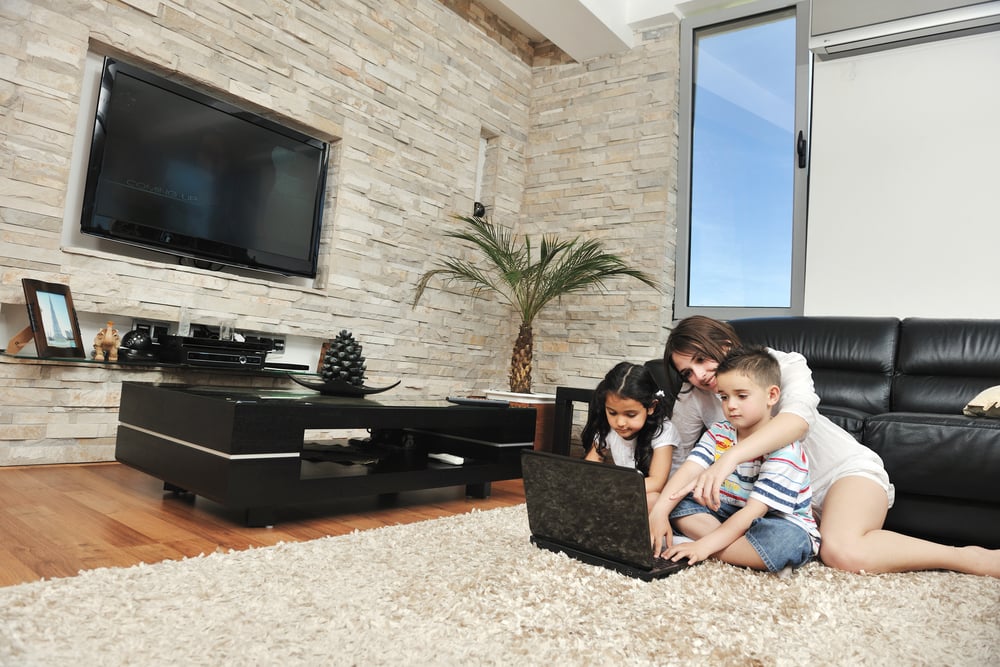 happy young family have fun and working on laptop at modern  home livingroom indoor-1