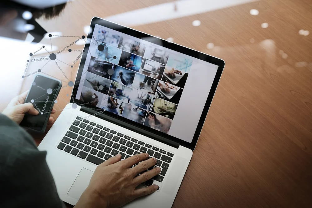 top view of businessman hand working with new modern computer and smart phone and business strategy on wooden desk with social media network as concept-1